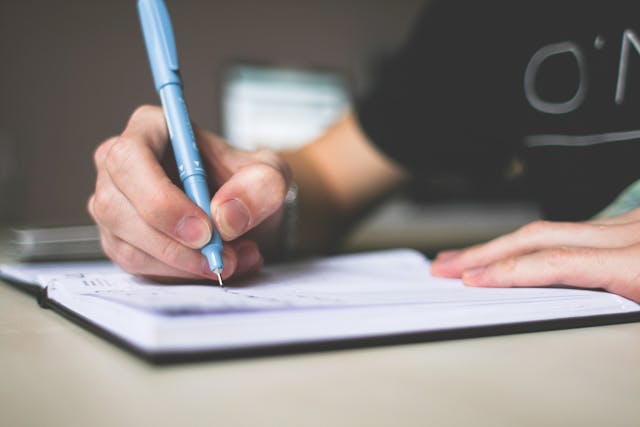 A person writing in a journal.