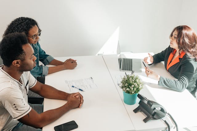 Two people talking to a property manager